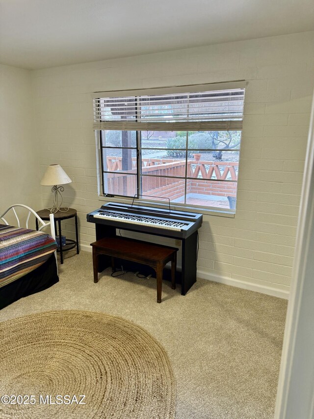 carpeted bedroom featuring baseboards