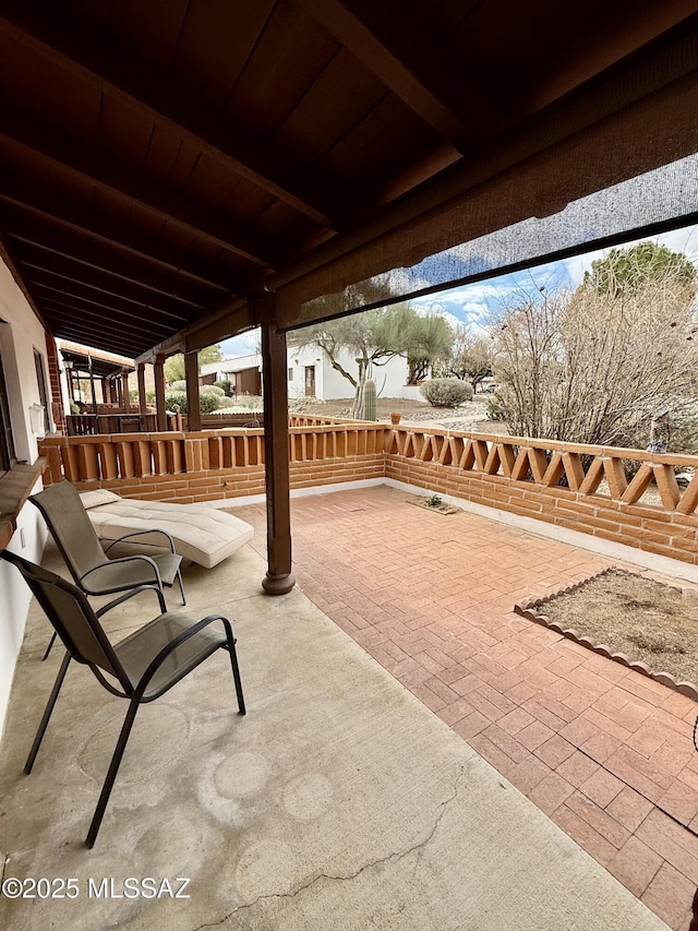 view of patio / terrace featuring fence