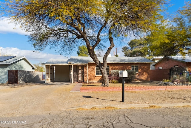 single story home with a carport