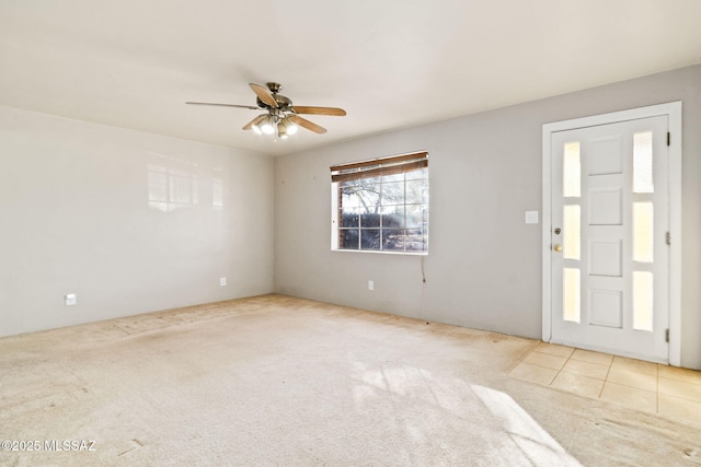 empty room with light carpet and ceiling fan