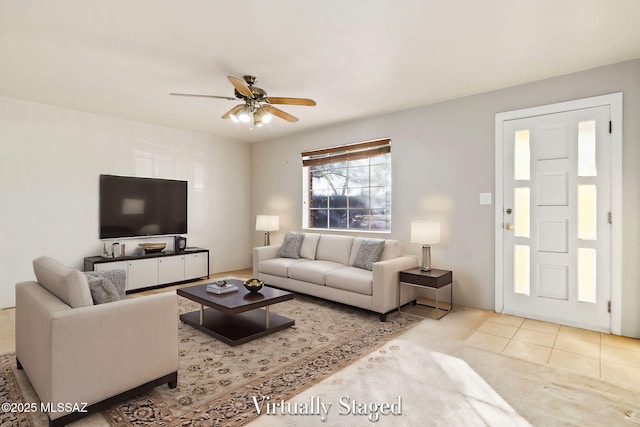 carpeted living room with ceiling fan