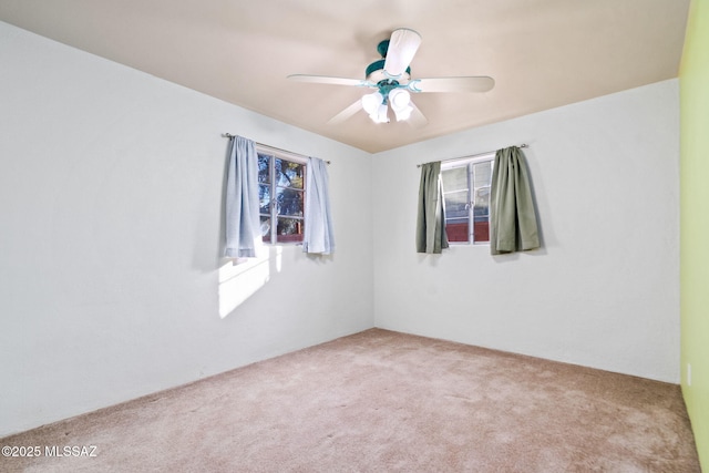 unfurnished room featuring carpet flooring and ceiling fan