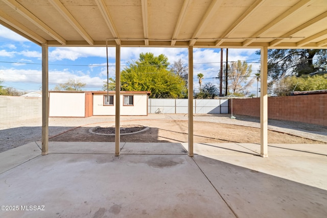 view of patio / terrace featuring a storage unit