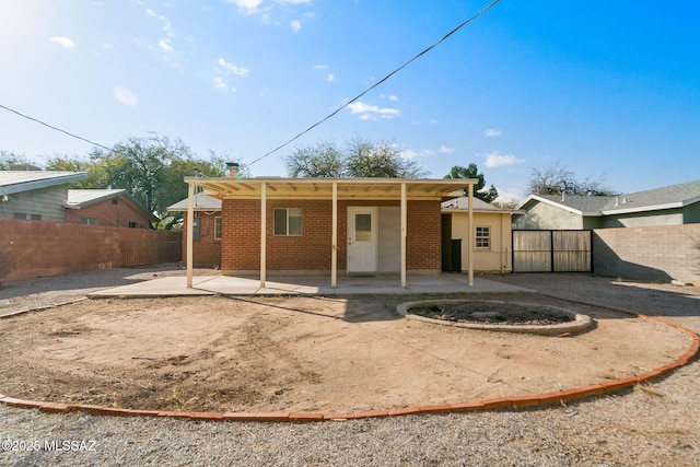 rear view of property with a patio area