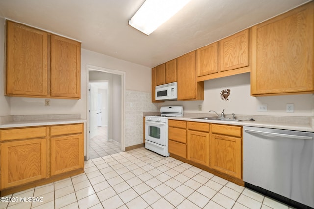 kitchen featuring sink and white appliances