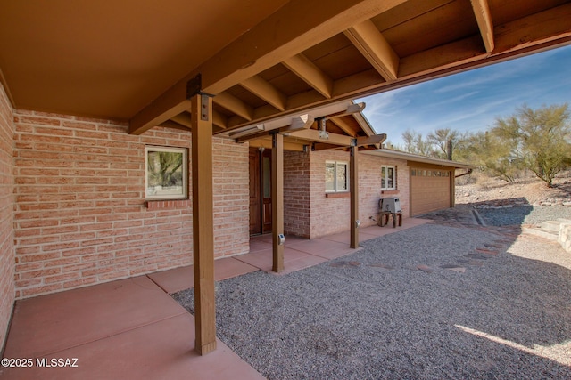 view of patio / terrace featuring a garage