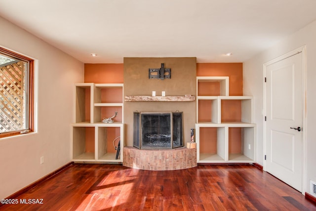 unfurnished living room with dark hardwood / wood-style flooring