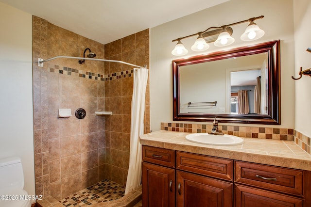 bathroom with vanity, backsplash, toilet, and a shower with shower curtain