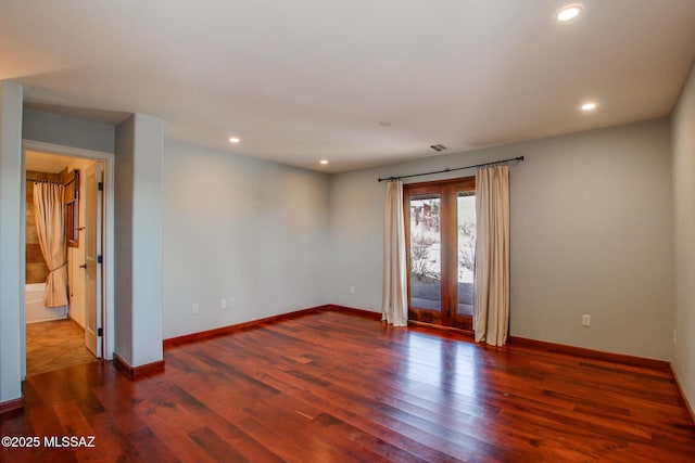 empty room with dark hardwood / wood-style floors