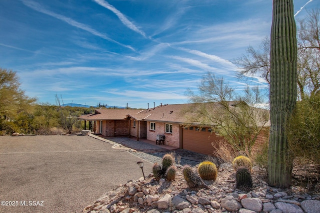 single story home featuring a garage