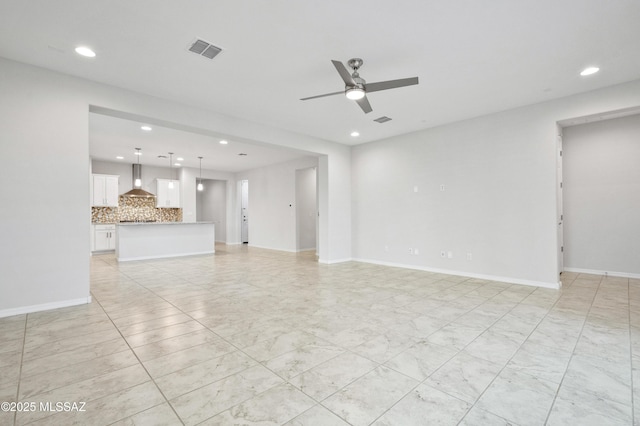 8270 W Spaulding St, Tucson, AZ 85743 - unfurnished living room featuring recessed lighting, ceiling fan, and baseboards