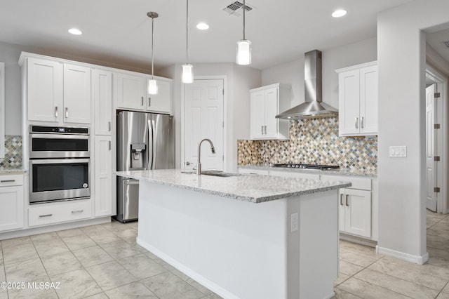 8270 W Spaulding St, Tucson, AZ 85743 - kitchen featuring wall chimney exhaust hood, appliances with stainless steel finishes, a sink, tasteful backsplash, and white cabinetry