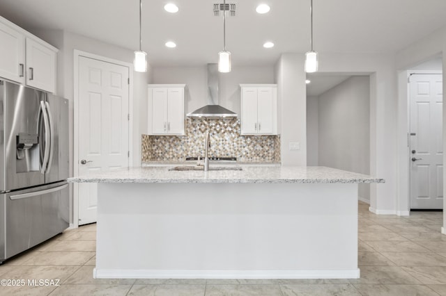 8270 W Spaulding St, Tucson, AZ 85743 - kitchen with stainless steel fridge, wall chimney range hood, white cabinetry, backsplash, and recessed lighting