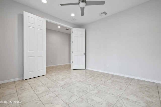 8270 W Spaulding St, Tucson, AZ 85743 - unfurnished bedroom with recessed lighting, baseboards, and a ceiling fan
