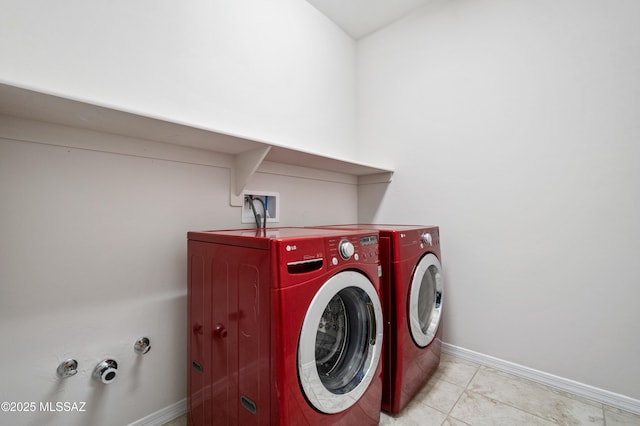 8270 W Spaulding St, Tucson, AZ 85743 - laundry room with washing machine and clothes dryer, baseboards, and light tile patterned floors