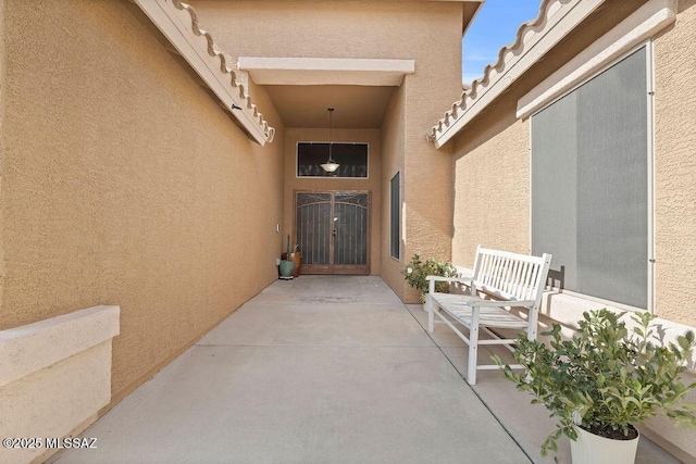 entrance to property featuring a patio