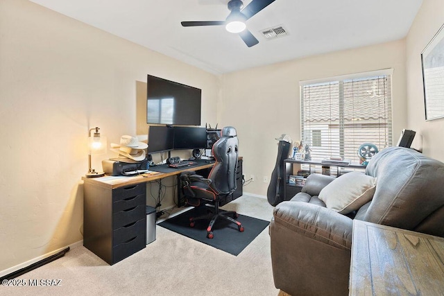 carpeted home office with ceiling fan