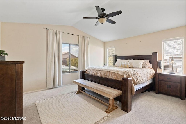 carpeted bedroom with lofted ceiling and ceiling fan