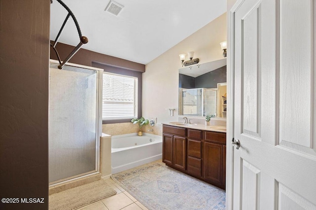 bathroom with lofted ceiling, tile patterned floors, independent shower and bath, and vanity