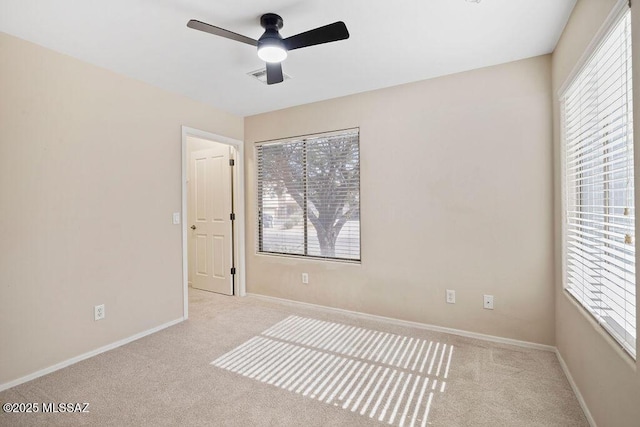 carpeted empty room with ceiling fan