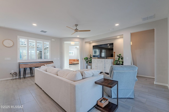 living room featuring ceiling fan