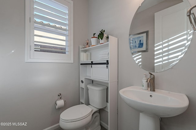 bathroom with toilet and sink