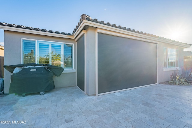 view of home's exterior with a patio area