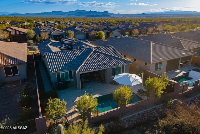 birds eye view of property with a mountain view