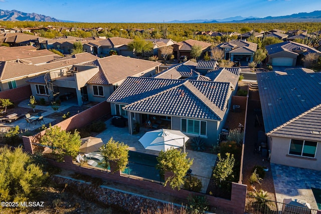 birds eye view of property featuring a mountain view