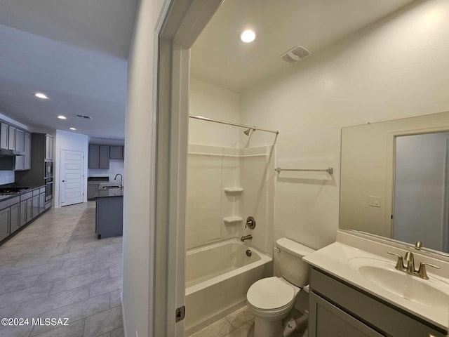 full bathroom featuring vanity, shower / washtub combination, and toilet