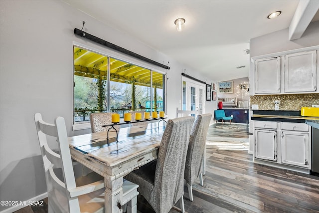 dining space with dark wood-type flooring