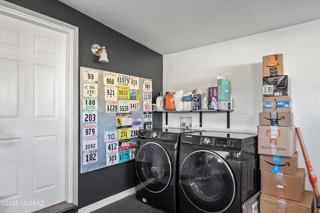 washroom with washing machine and dryer