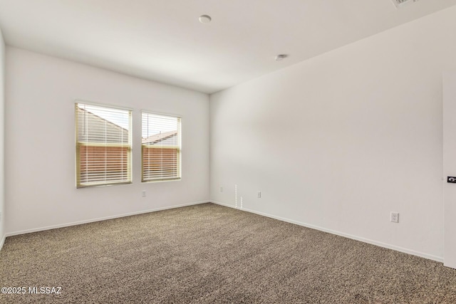 empty room featuring carpet flooring