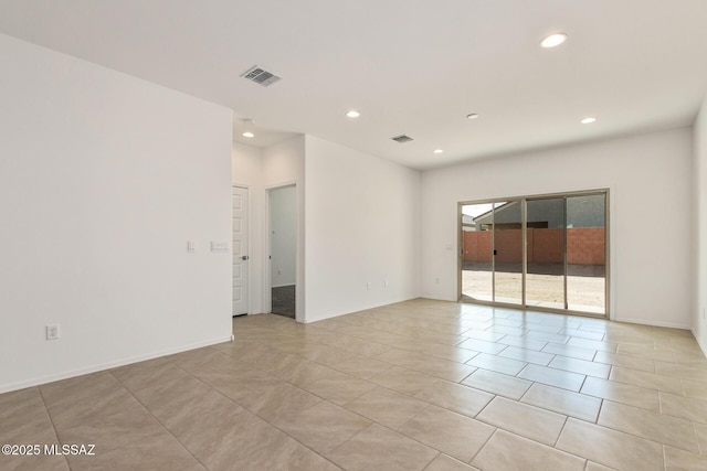 unfurnished room with light tile patterned floors