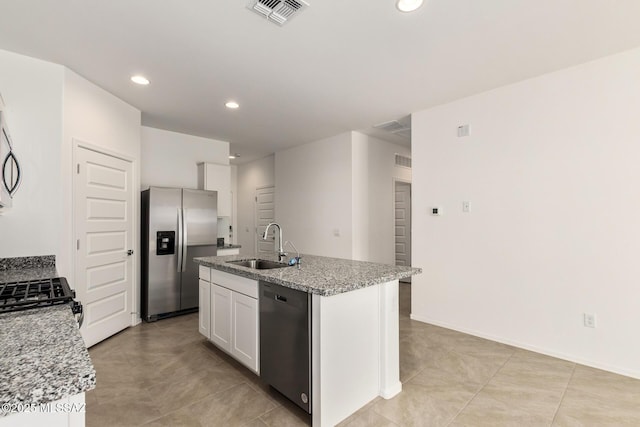 kitchen featuring white cabinetry, sink, light stone counters, and black appliances