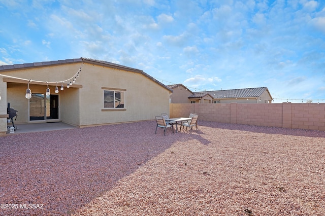 rear view of house with a patio area