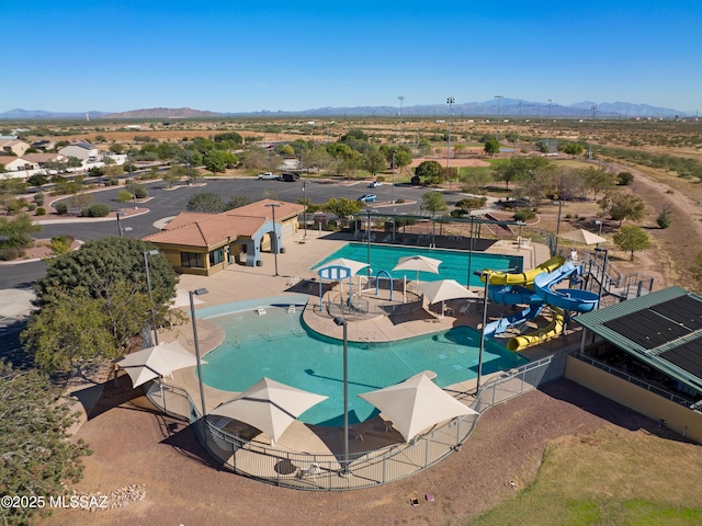 birds eye view of property with a mountain view