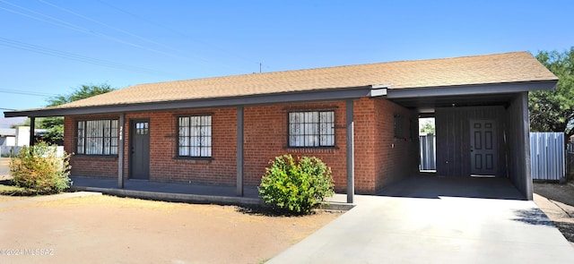 view of front of home with a carport