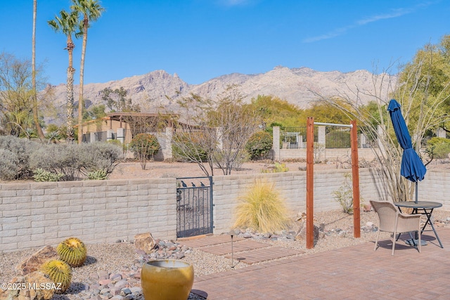 5658 N Calle De La Reina, Tucson, AZ 85718 - view of patio with a mountain view and a gate