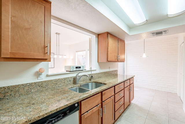 5658 N Calle De La Reina, Tucson, AZ 85718 - kitchen featuring a sink, brick wall, light stone countertops, stainless steel dishwasher, and decorative light fixtures