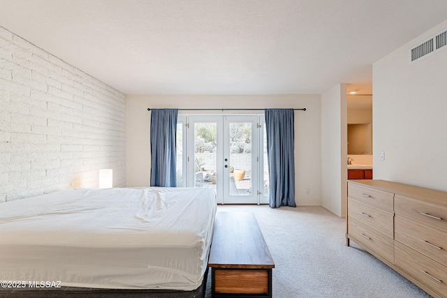 bedroom with visible vents, light colored carpet, access to exterior, french doors, and a sink