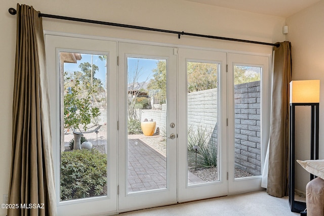 5658 N Calle De La Reina, Tucson, AZ 85718 - entryway featuring french doors and light colored carpet