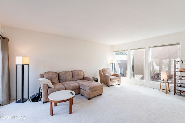 living area with light carpet