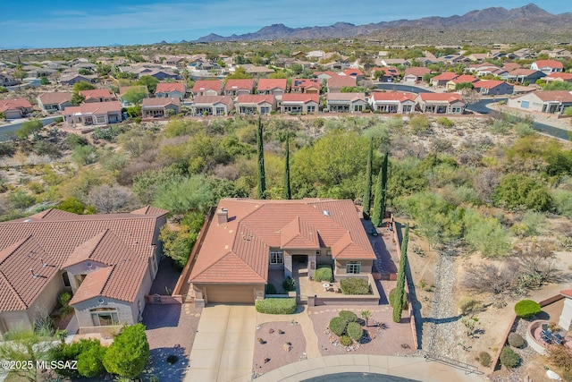 drone / aerial view featuring a mountain view