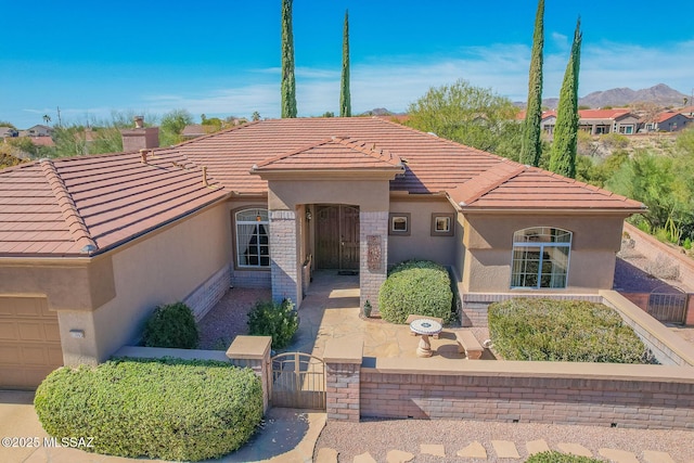 view of front of property featuring a mountain view and a patio area