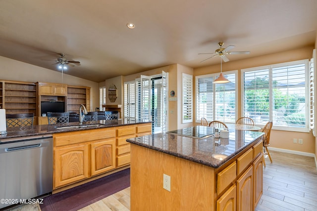 kitchen with a kitchen island with sink, sink, ceiling fan, dishwasher, and black electric stovetop