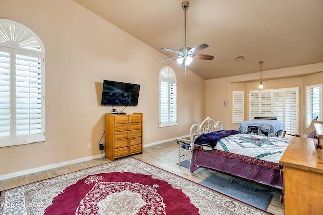 bedroom featuring vaulted ceiling and hardwood / wood-style floors