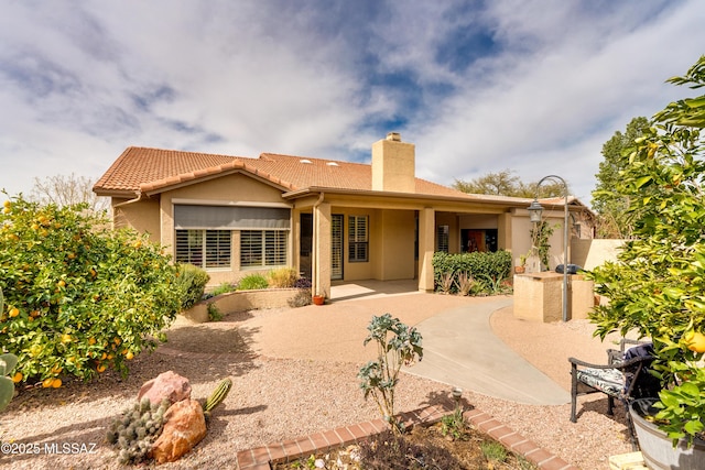 back of house featuring a patio