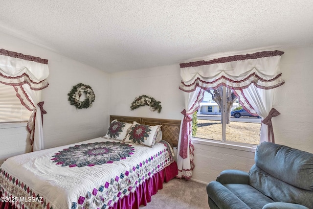 carpeted bedroom with a textured ceiling