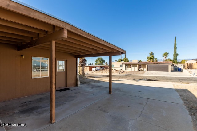 view of patio featuring a garage